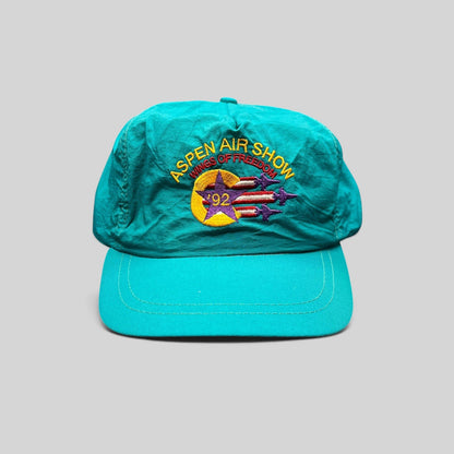 Raree Finds vintage 1992 Aspen Air Show teal nylon snapback hat with Wings of Freedom embroidered graphic