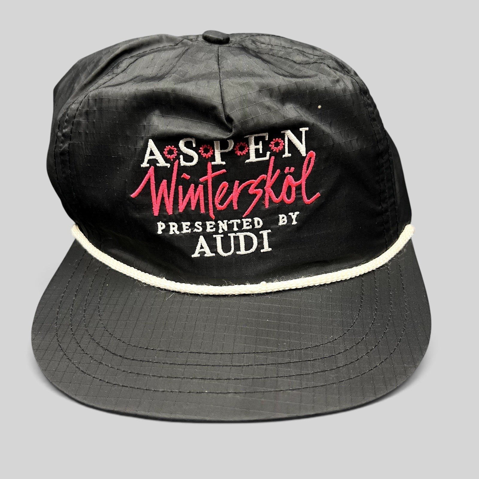 Raree Finds vintage black ripstop nylon Aspen Wintersköl Audi snapback hat with white rope and pink embroidered logo