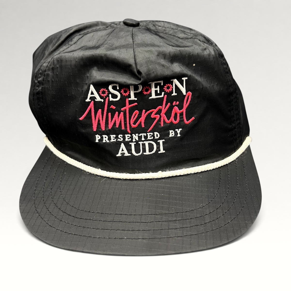 Raree Finds vintage black ripstop nylon Aspen Wintersköl Audi snapback hat with white rope and pink embroidered logo