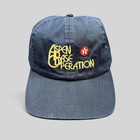 Raree Finds vintage navy blue Aspen Base Operation strapback hat with yellow embroidered logo and red mountain emblem