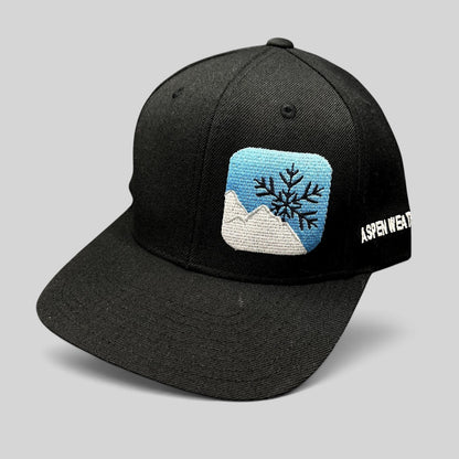 Raree Finds vintage black Yupoong snapback hat with embroidered mountain and snowflake logo and side text