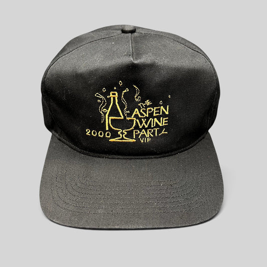 Raree Finds vintage 2000 Aspen Wine Party VIP black strapback hat with gold embroidered champagne bottle graphic