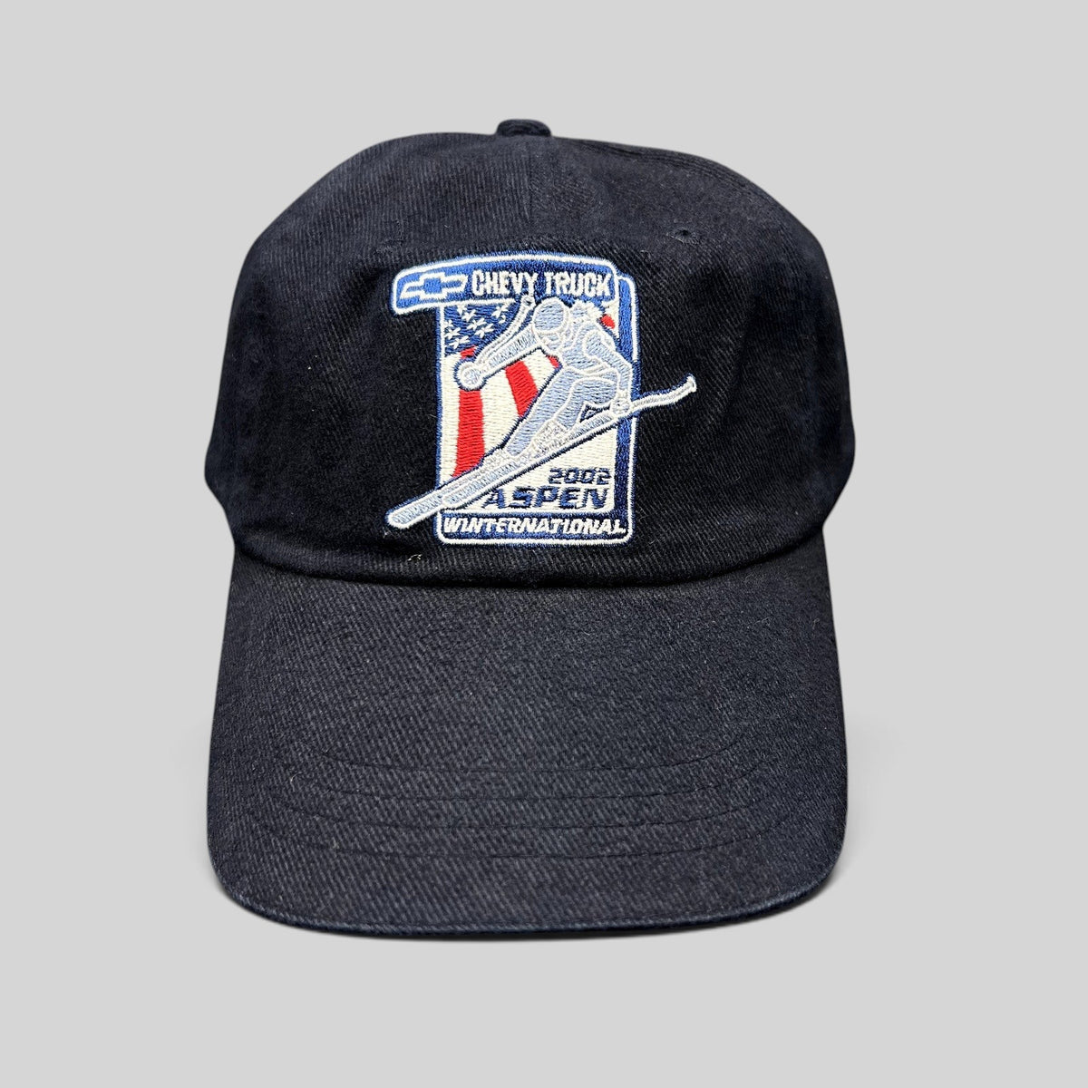 Raree Finds vintage 2002 Aspen Winternational strapback hat in navy with embroidered Chevy Truck skier patch