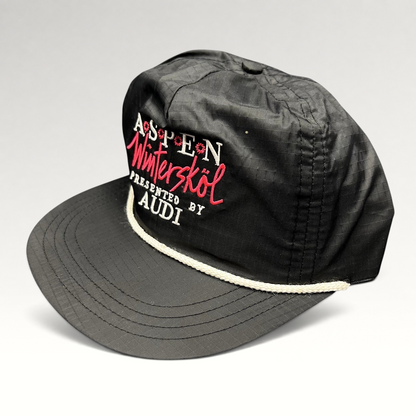 Raree Finds vintage black ripstop nylon Aspen Wintersköl Audi snapback hat with white rope detail and pink embroidery.