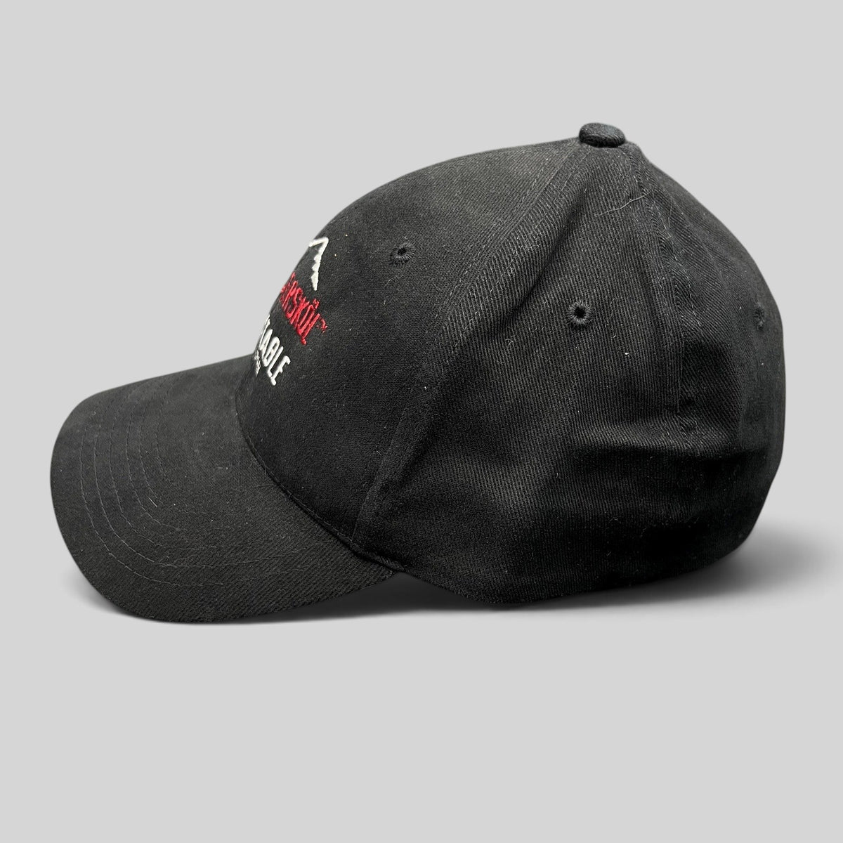 Raree Finds vintage 2004 black cotton stretch-fit cap with embroidered Aspen Wintersköl and Ink! Coffee branding.