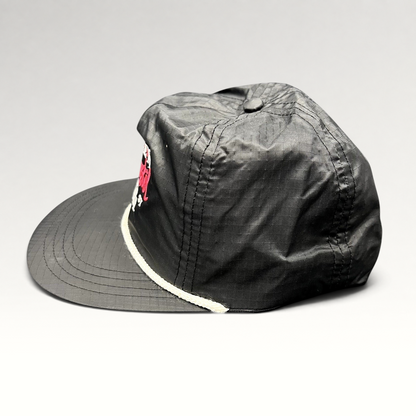 Raree Finds vintage black ripstop nylon snapback hat with white rope detail and Aspen Wintersköl Audi embroidery.