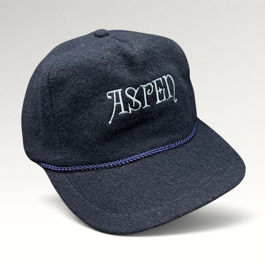 Raree Finds vintage navy wool snapback hat with Aspen script embroidery and decorative rope detail on the brim.