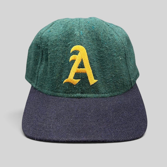 Raree Finds vintage Aspen Colorado wool ski cap in forest green with a gold embroidered A and navy blue brim