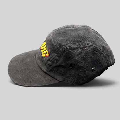 Raree Finds vintage black cotton Atomic ARC strapback hat with yellow and red embroidered logo, side profile view.
