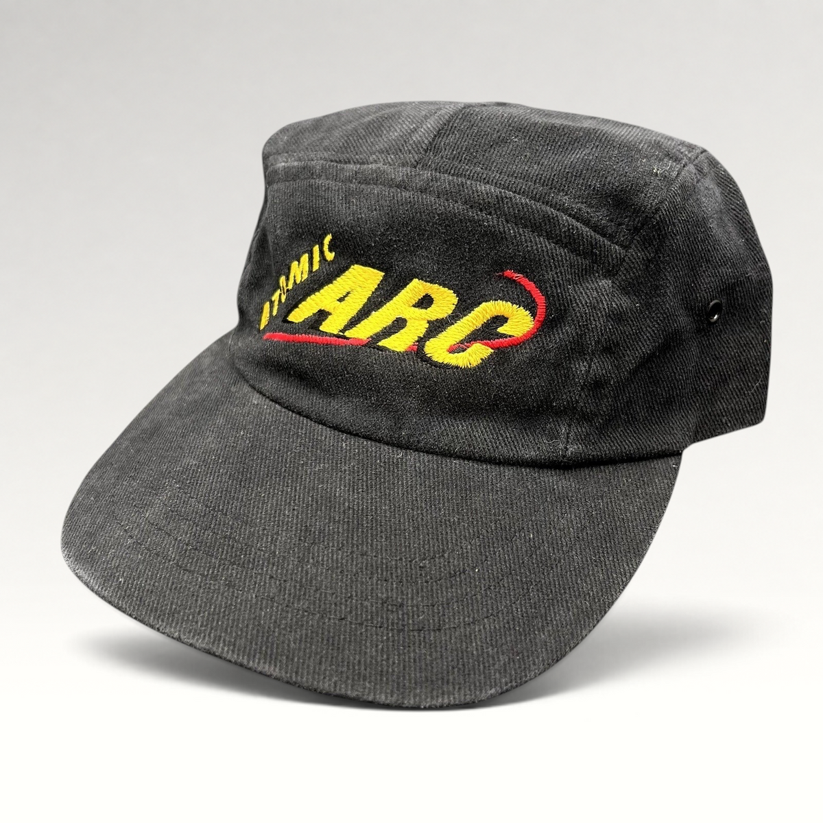 Raree Finds vintage black cotton Atomic ARC strapback hat with yellow and red embroidered logo