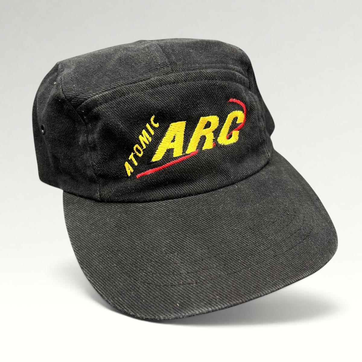 Raree Finds vintage black cotton Atomic ARC strapback hat with yellow and red embroidered logo