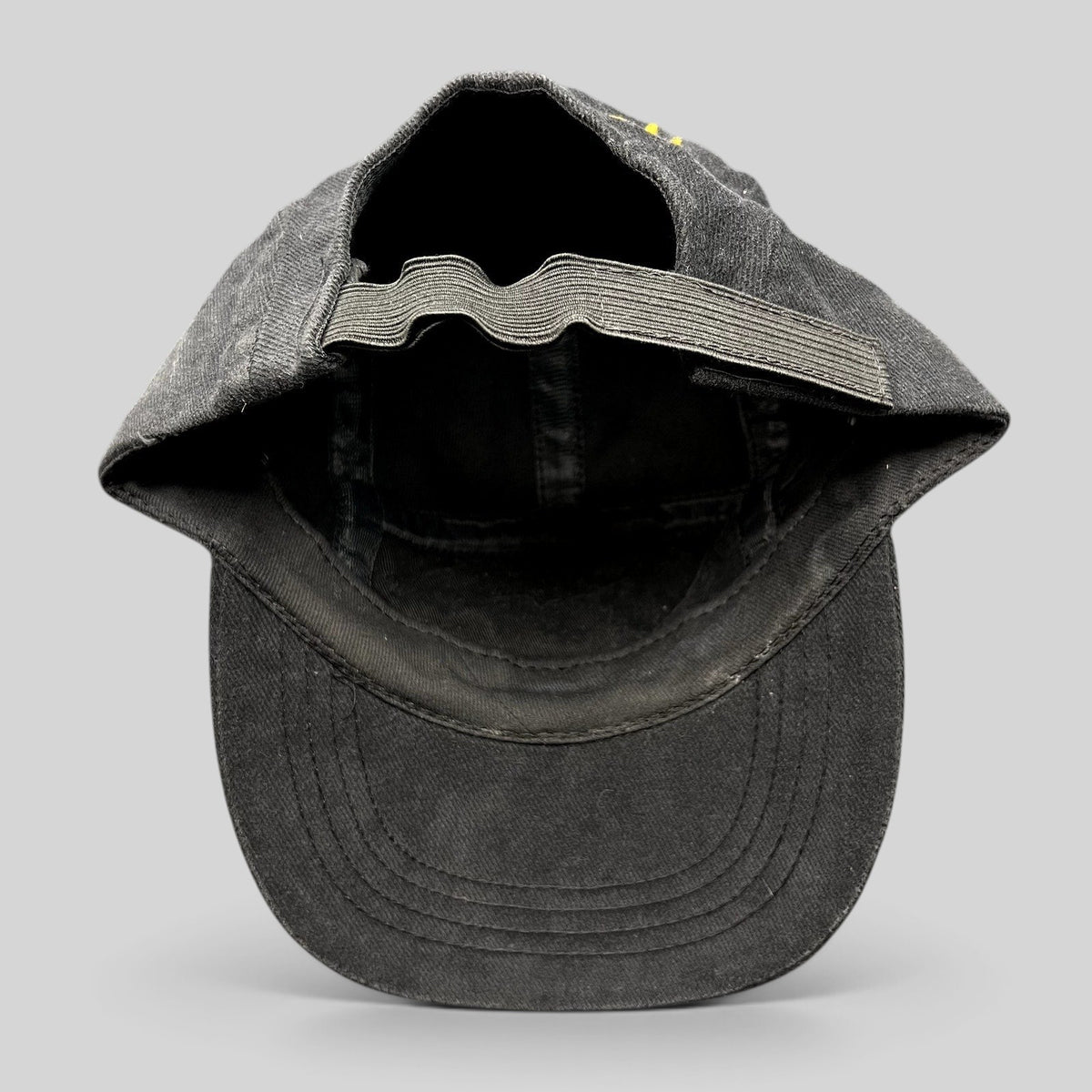 Raree Finds vintage black cotton Atomic ARC ski hat showing the elastic adjustable strapback and interior construction