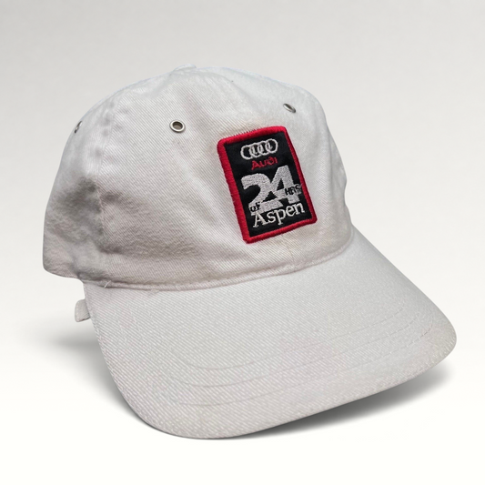 Raree Finds vintage white Audi 24 HRS of Aspen cotton strapback hat with a motorsport embroidered patch.