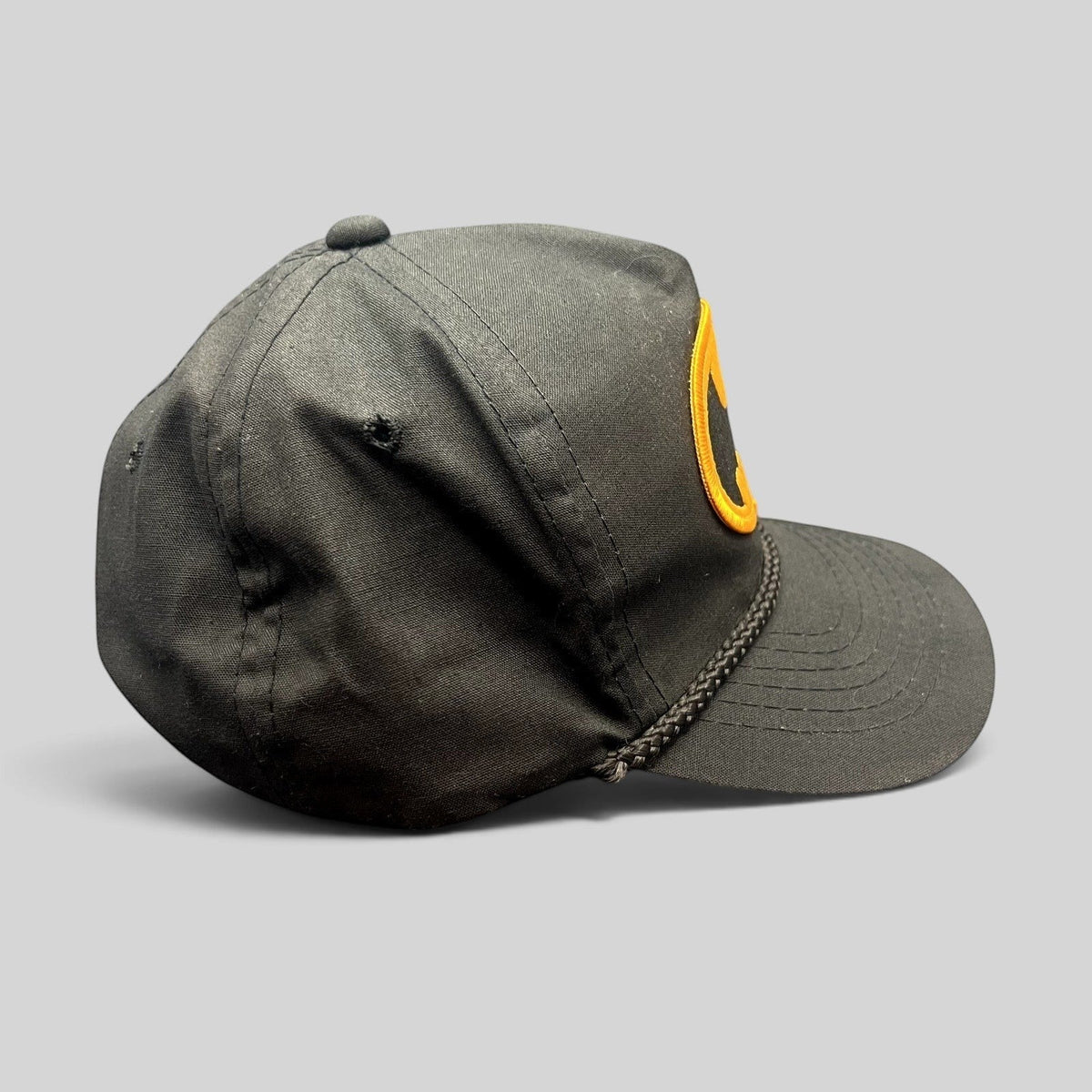 Raree Finds vintage black Batman snapback hat with a braided rope detail and yellow embroidered logo patch