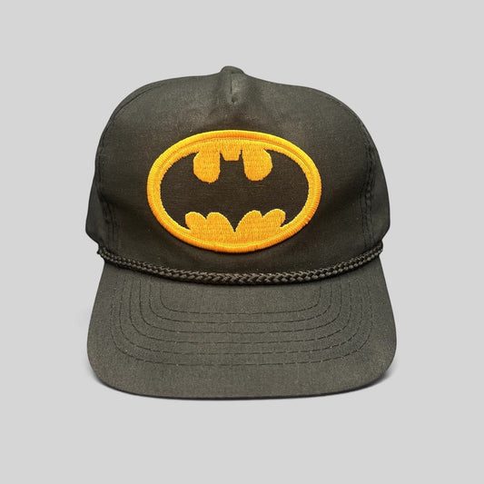 Raree Finds vintage black Batman snapback hat with yellow embroidered logo patch and braided rope detail