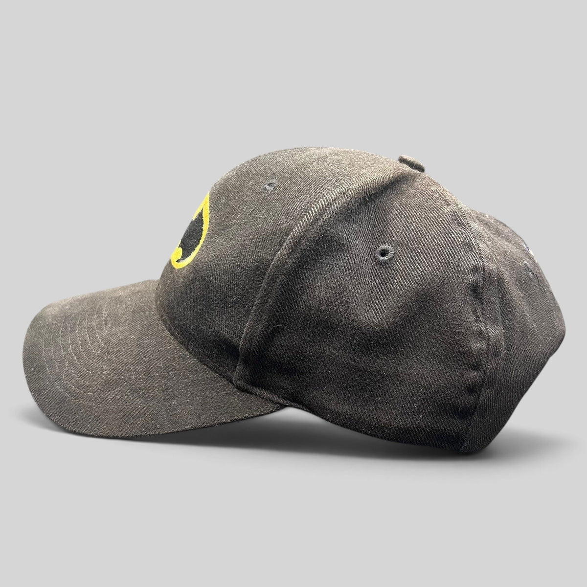 Raree Finds vintage black Batman strapback hat with yellow and black embroidered logo on the front