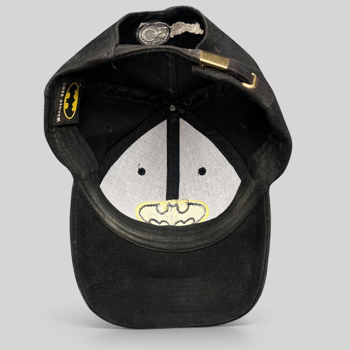 Raree Finds vintage Warner Bros Batman strapback hat in black with interior logo embroidery and metal buckle closure