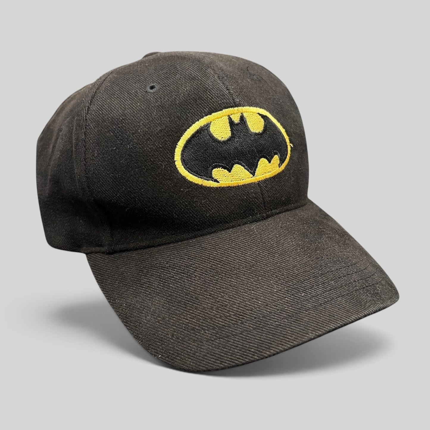 Raree Finds vintage black Batman strapback hat with embroidered yellow and black logo on the front crown