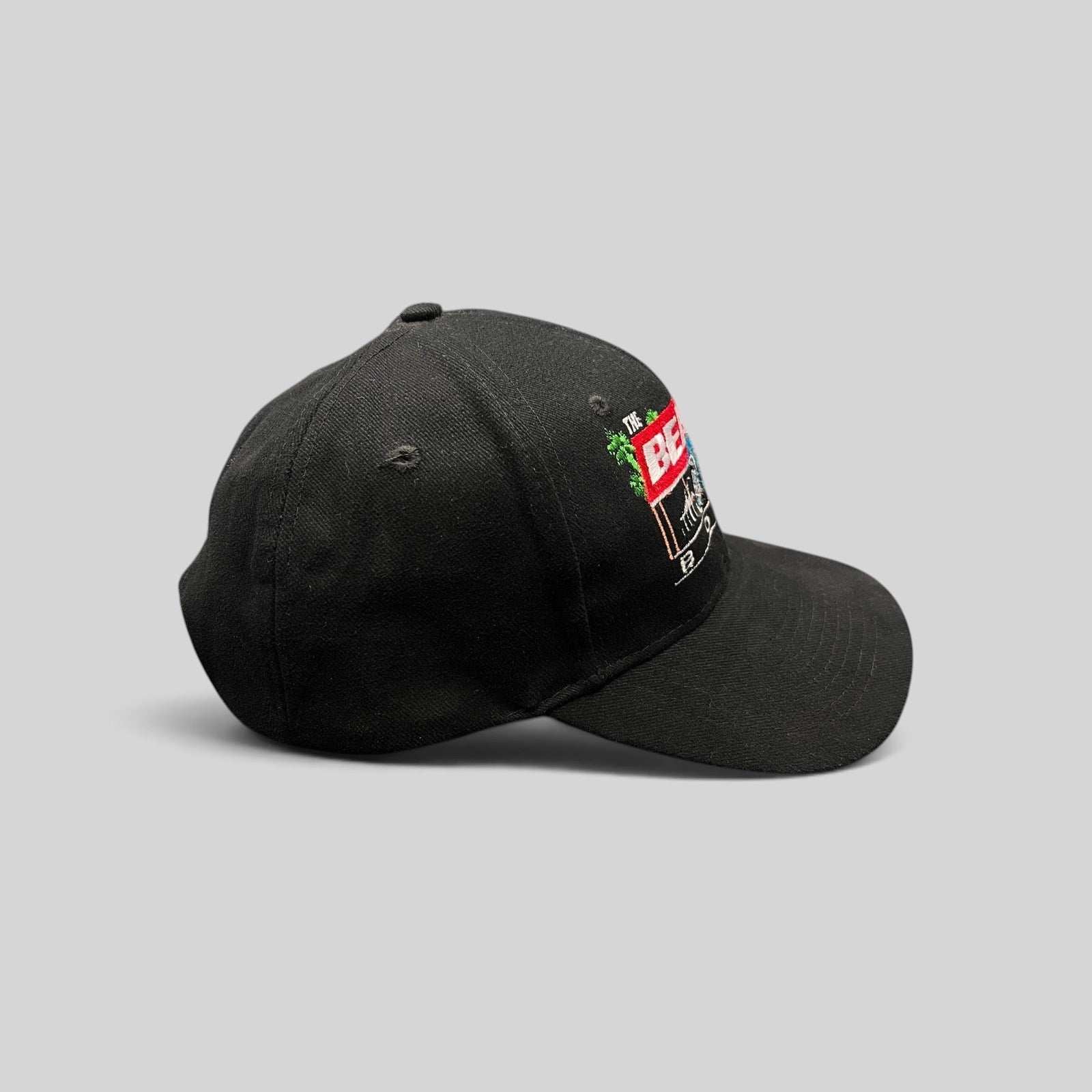 Raree Finds vintage 1990s black Beach Boys snapback hat with Little Deuce Coupe hot rod embroidery on the front