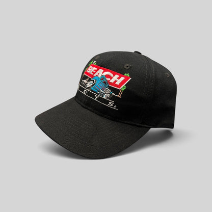 Raree Finds vintage 1990s black Beach Boys snapback hat featuring a colorful Little Deuce Coupe hot rod embroidery.