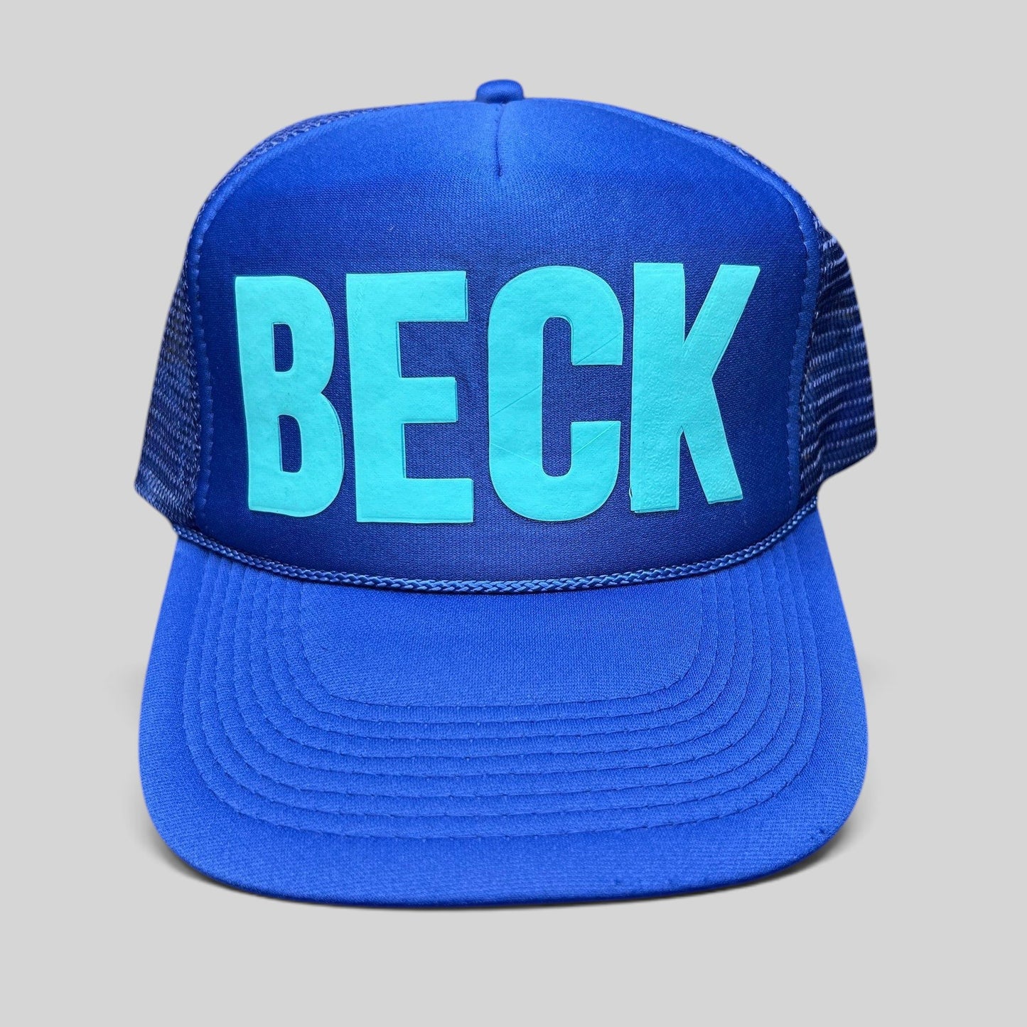 Raree Finds vintage Otto Collection royal blue foam trucker hat with teal BECK graphic and mesh back