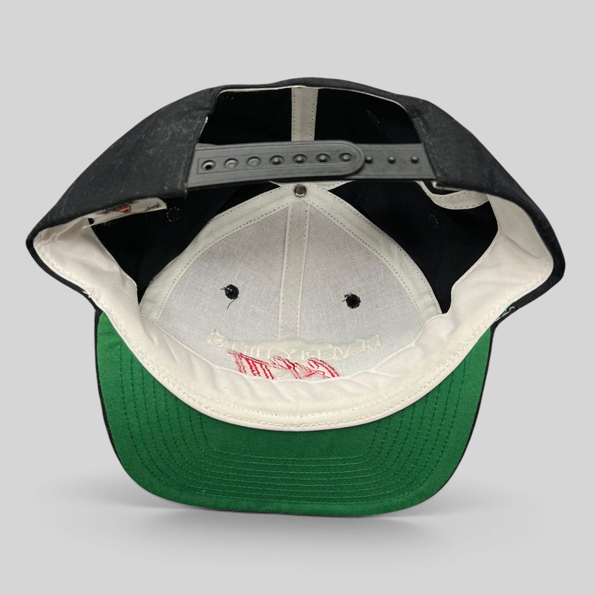 Raree Finds vintage 1994 Beverly Hills Cop III snapback hat interior showing green undervisor and black snap closure