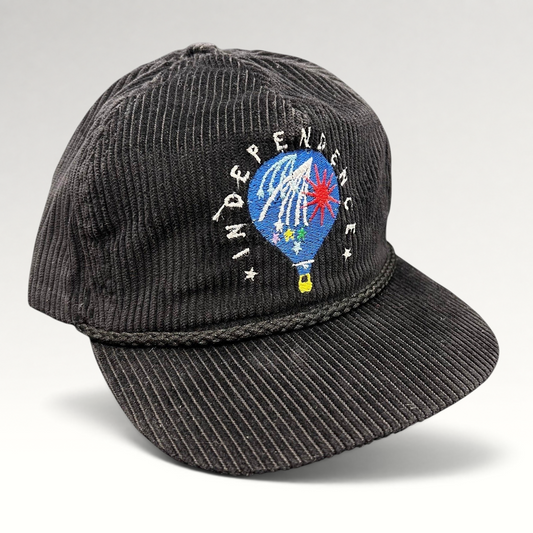 Raree Finds vintage black corduroy strapback hat with a hot air balloon embroidery and rope brim detail.