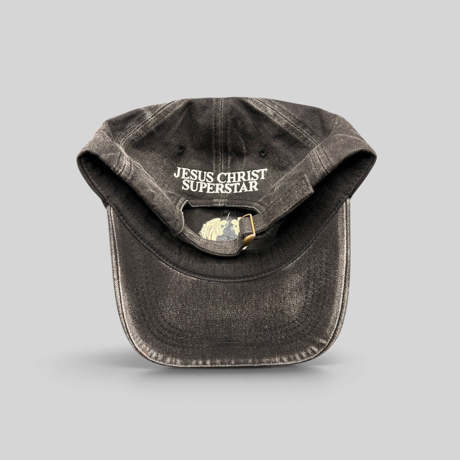 Raree Finds vintage Jesus Christ Superstar black dad hat with adjustable brass buckle and internal logo embroidery