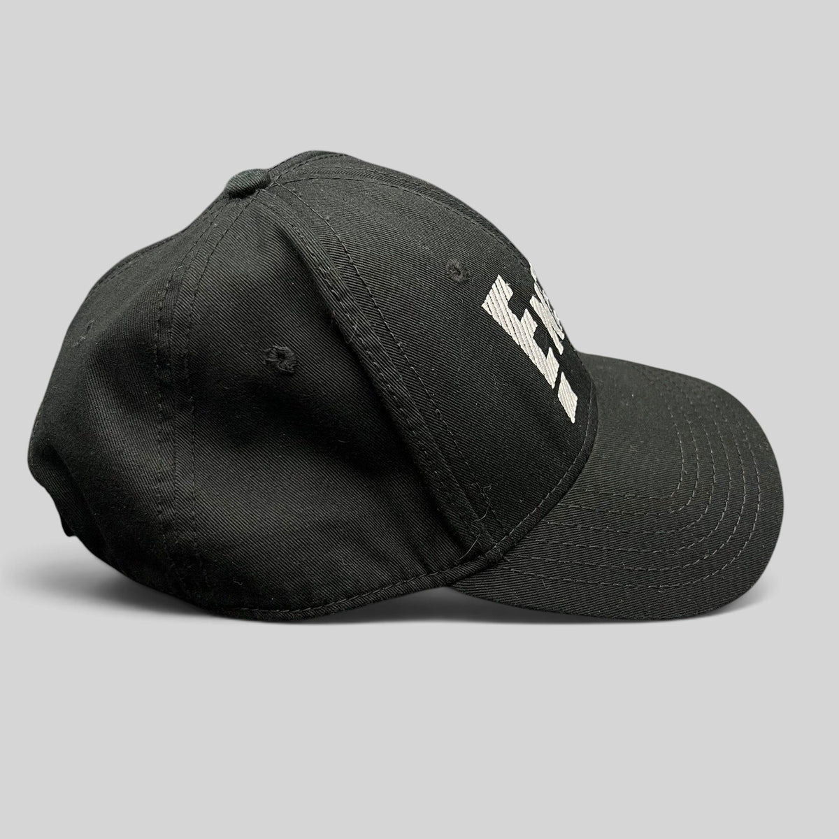 Raree Finds vintage black OTTO Cap snapback featuring an embroidered white E! News logo on the front
