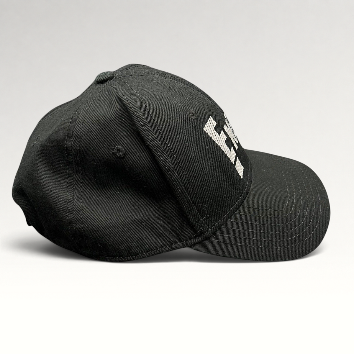 Raree Finds vintage black OTTO Cap snapback featuring an embroidered white E! News logo on the front