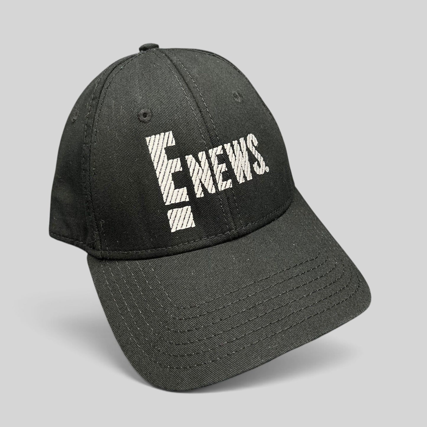 Raree Finds vintage black OTTO Cap snapback hat featuring an embroidered white E! News logo on the front
