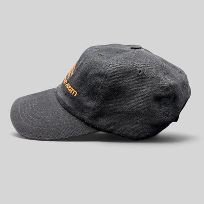 Raree Finds vintage black cotton strapback hat with orange FilmBazaar.com logo embroidery, side profile view.