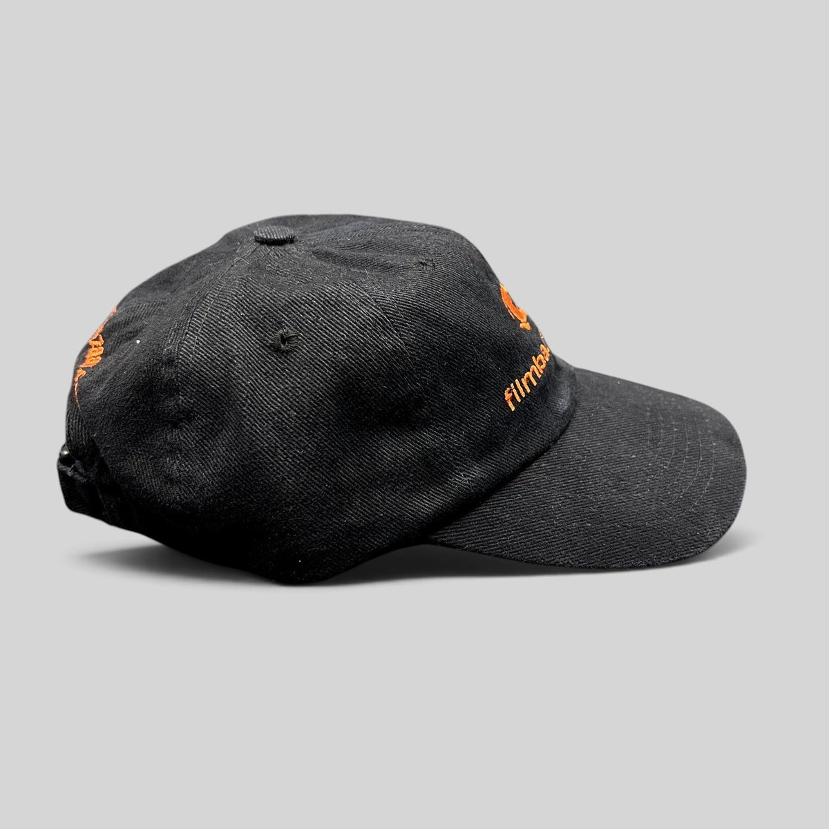 Raree Finds vintage black cotton strapback hat with orange FilmBazaar.com embroidery and adjustable leather strap.