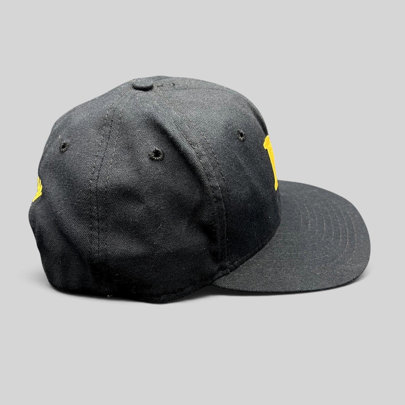 Raree Finds vintage black New Era snapback hat with gold embroidered M logo and structured crown