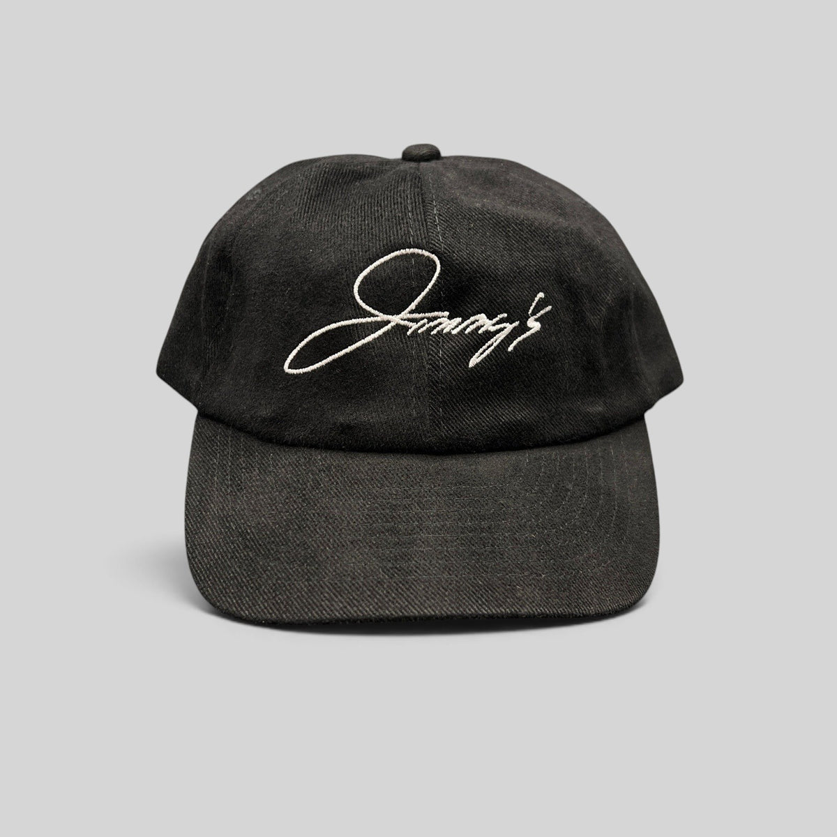 Raree Finds vintage black cotton strapback hat featuring white embroidered Jimmy's script logo on an unstructured crown