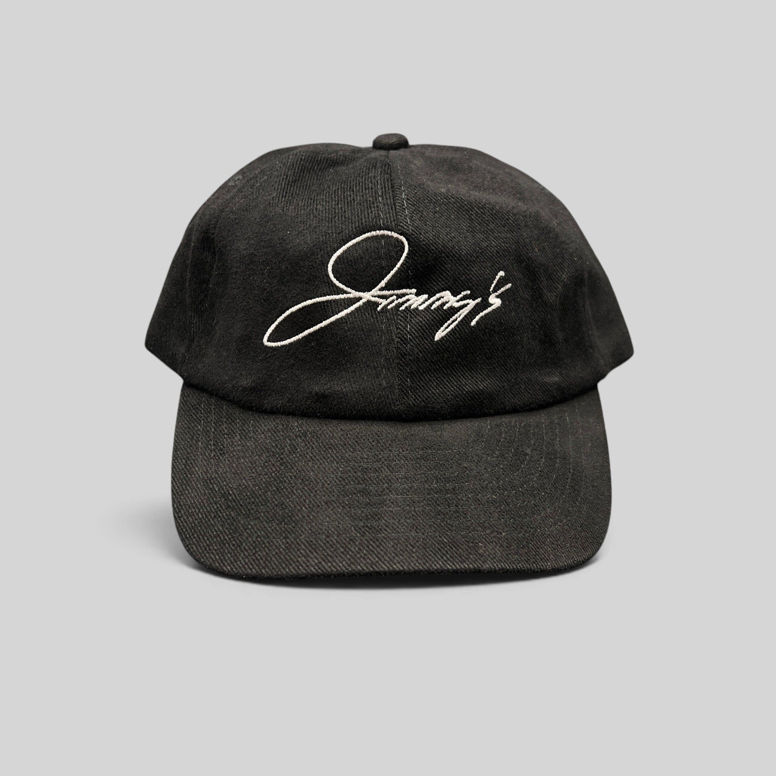 Raree Finds vintage black cotton strapback hat featuring white embroidered Jimmy's script logo on an unstructured crown