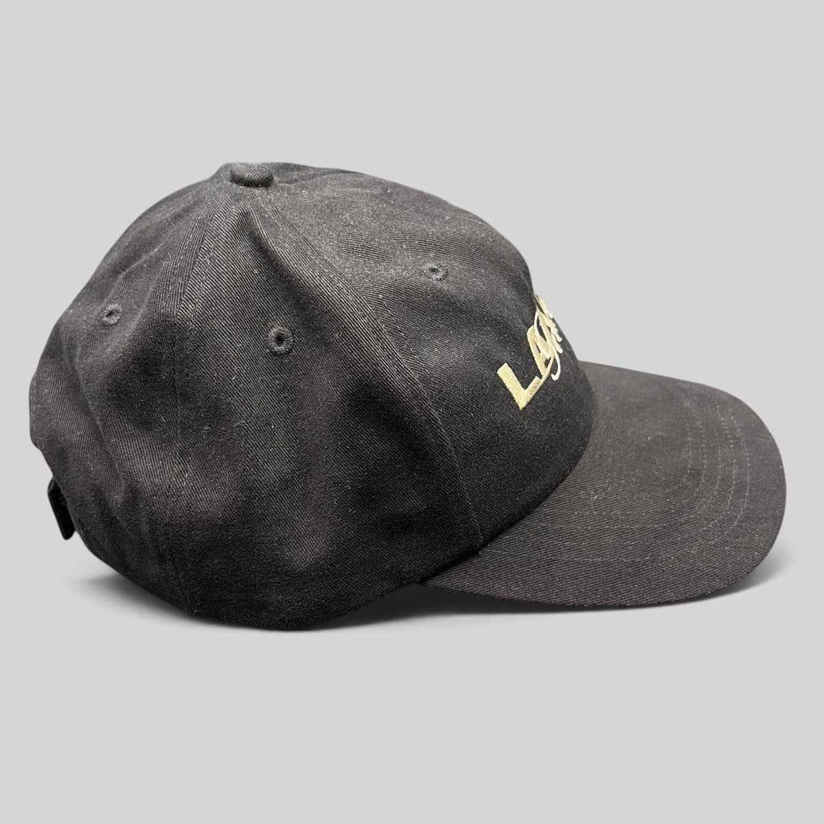Raree Finds vintage black 100% cotton strapback hat with embroidered Lake Geneva script logo and curved bill