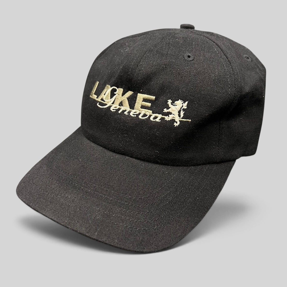 Raree Finds vintage black 100% cotton strapback hat with embroidered Lake Geneva script logo and crest graphic