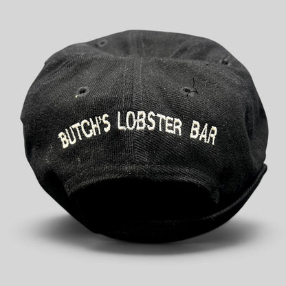 Raree Finds vintage 1990s black Timberline strapback hat featuring white embroidered Butch’s Lobster Bar rear branding