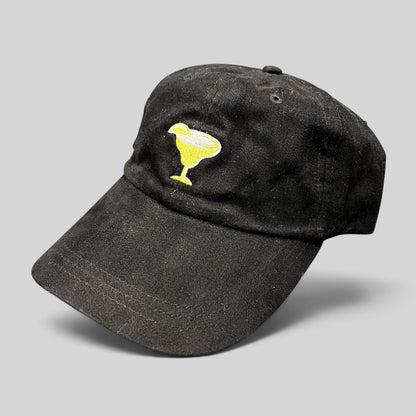 Raree Finds vintage black cotton strapback hat with an embroidered yellow margarita glass logo on the front.