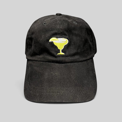 Raree Finds vintage black cotton strapback hat with an embroidered yellow margarita glass logo on the front.