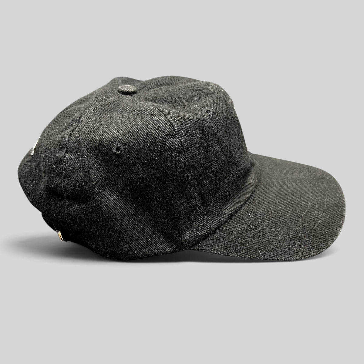 Raree Finds vintage 1990s black cotton twill strapback dad cap with Sandeman port wine logo embroidery