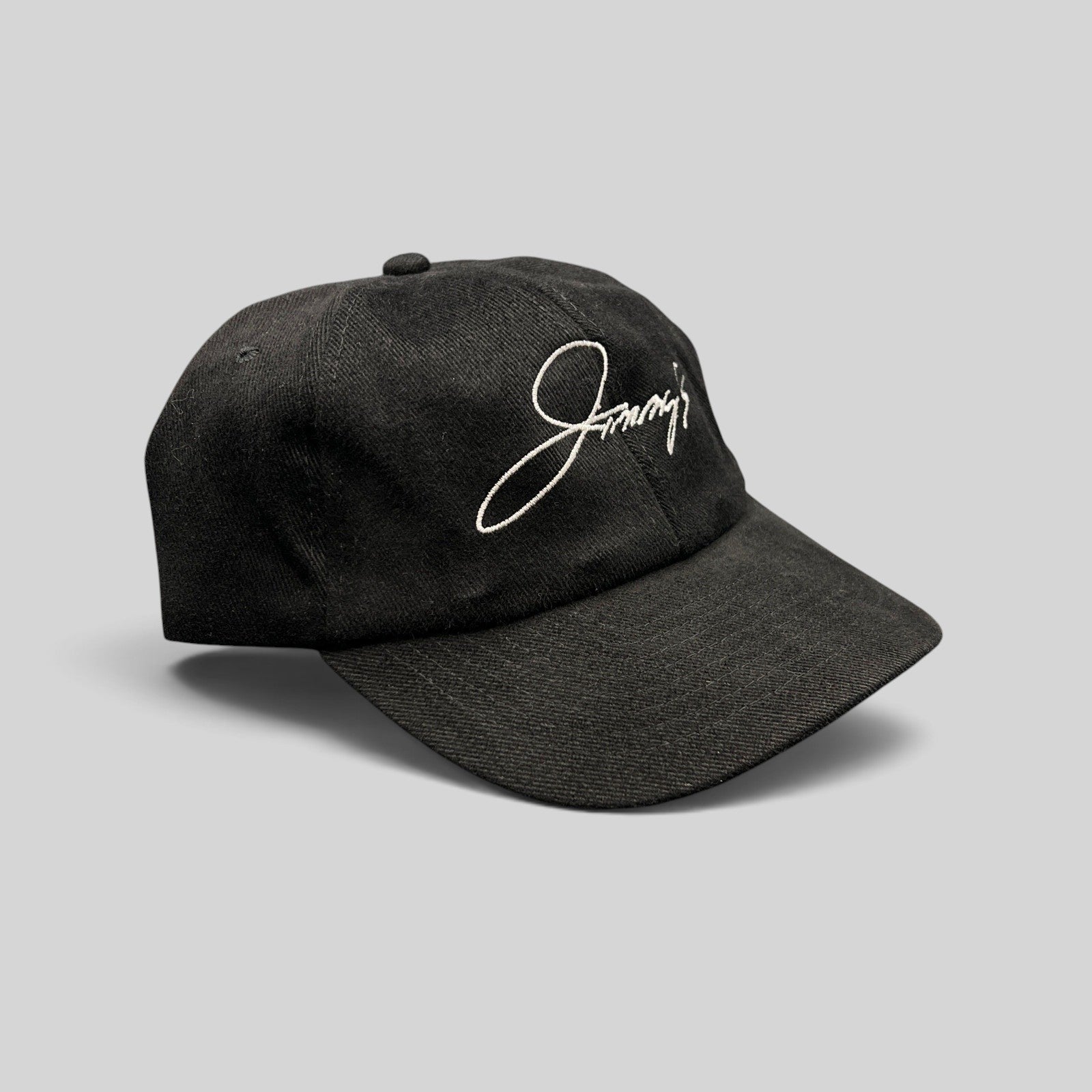 Raree Finds vintage black cotton twill strapback hat featuring white embroidered Jimmy's script logo on front