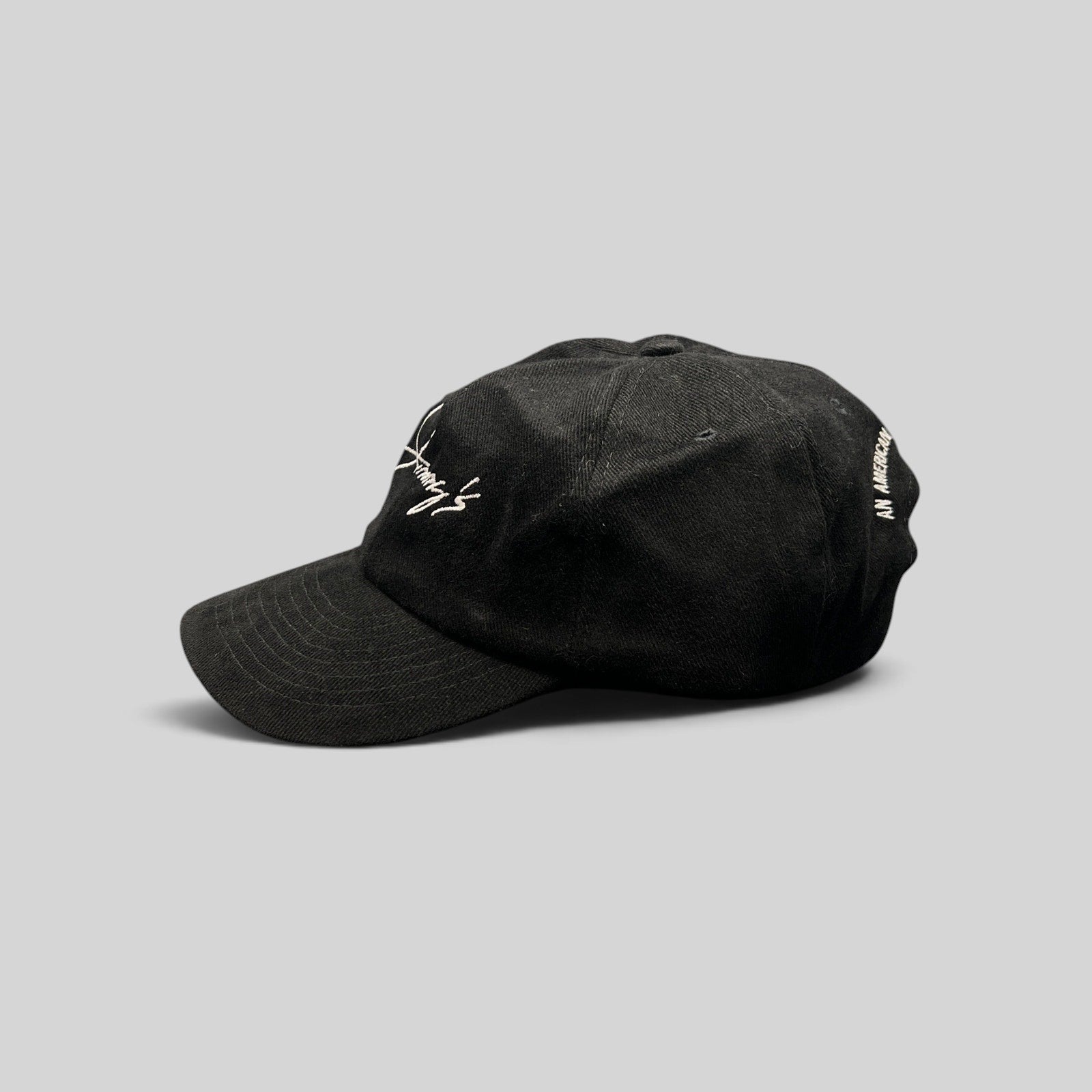 Raree Finds vintage black cotton twill strapback hat with white Jimmy's script logo embroidery and curved brim