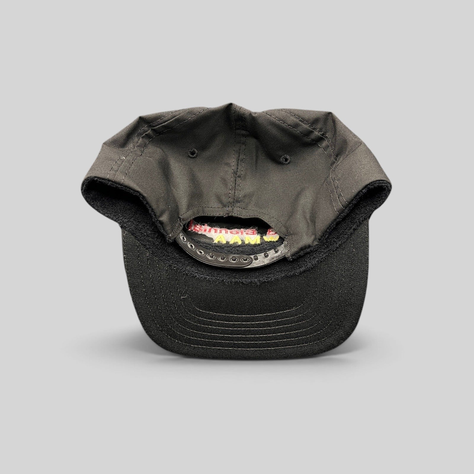 Raree Finds vintage 1993 WMAA Biennial black snapback cap with plastic closure and interior terry cloth sweatband.