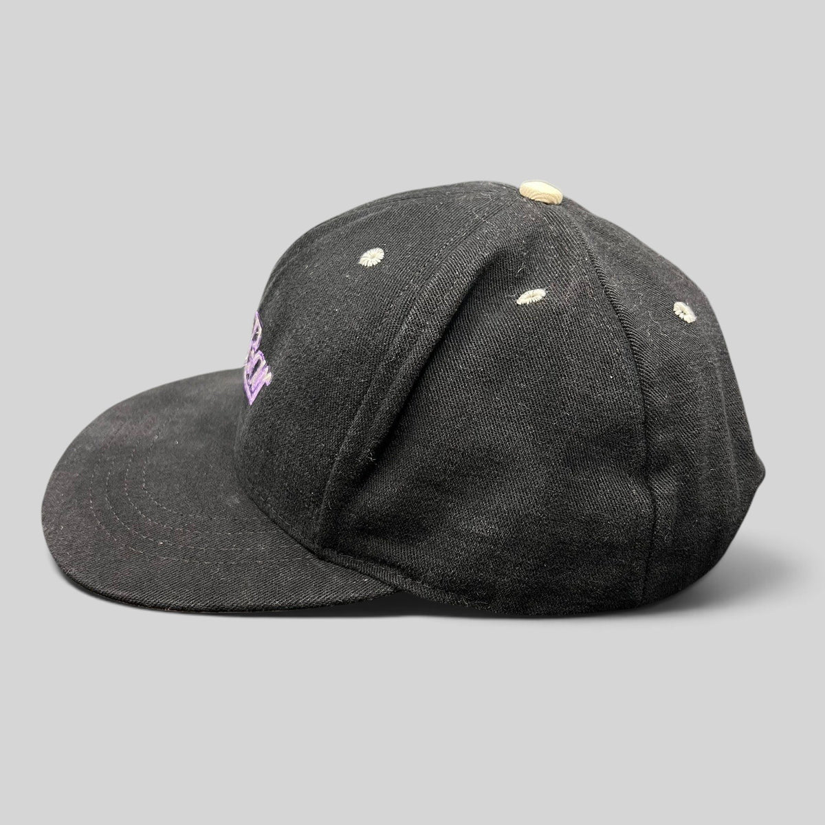 Raree Finds vintage 90s black snapback hat with purple script embroidery and a light gray brim