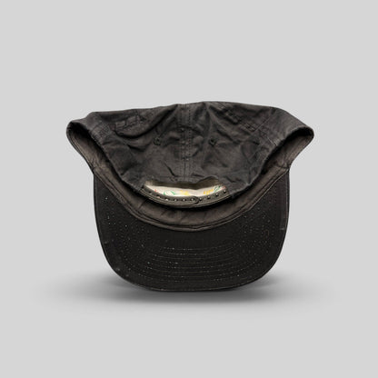 Raree Finds vintage 1990s black cotton snapback hat showing the interior adjustable plastic strap and unstructured crown