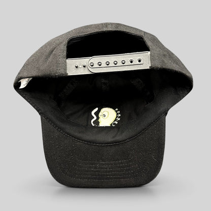Raree Finds vintage black snapback hat with adjustable plastic closure and interior embroidered cartoon graphic