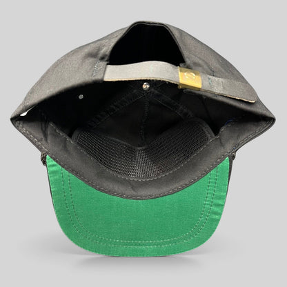 Raree Finds vintage SportSouth black strapback hat showing the interior green underbrim and adjustable brass slider