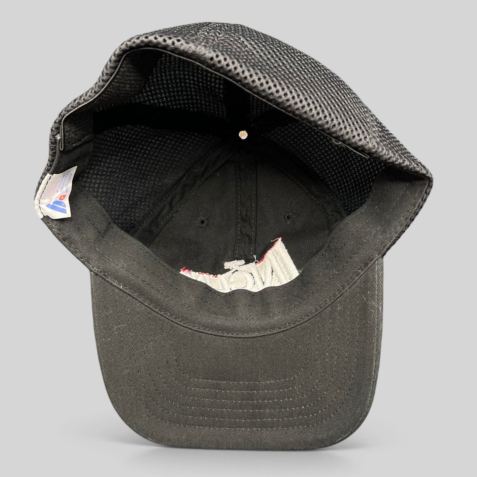Raree Finds vintage black Incline Ski Shop trucker hat, interior view showing mesh back and embroidered logo detail.